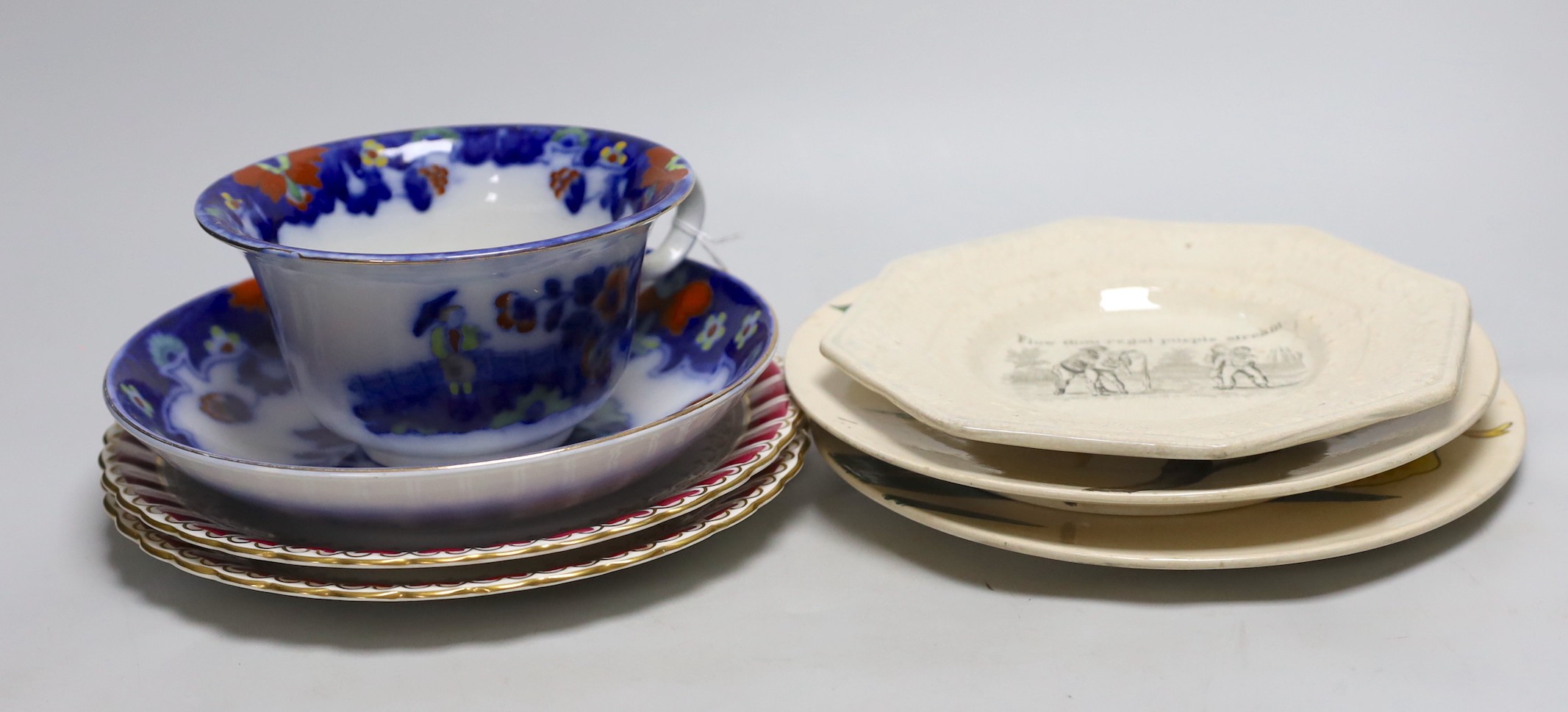A pair of Doulton plates, a pair of floral plates, a Victorian nursery plate and a large flow blue cup and saucer